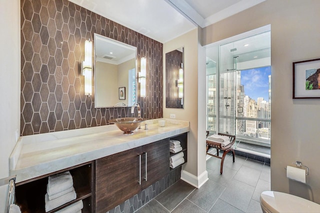 bathroom with tile patterned flooring, vanity, tile walls, a shower, and backsplash