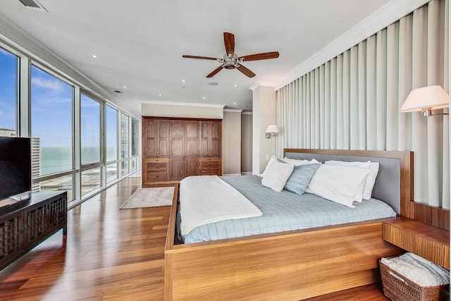 bedroom featuring ceiling fan, wood finished floors, access to exterior, crown molding, and recessed lighting