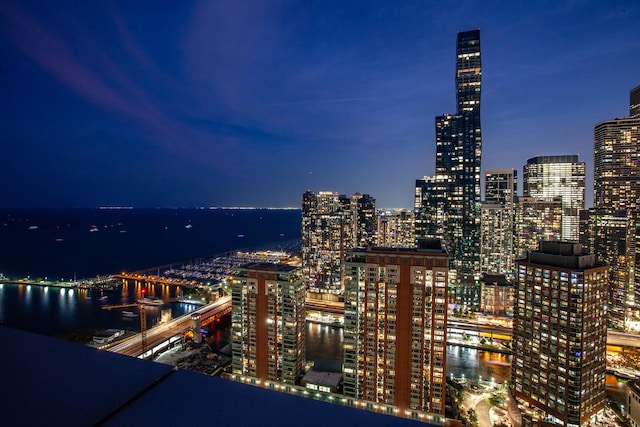 property's view of city featuring a water view