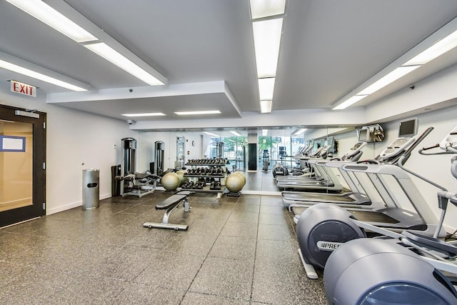 workout area featuring baseboards