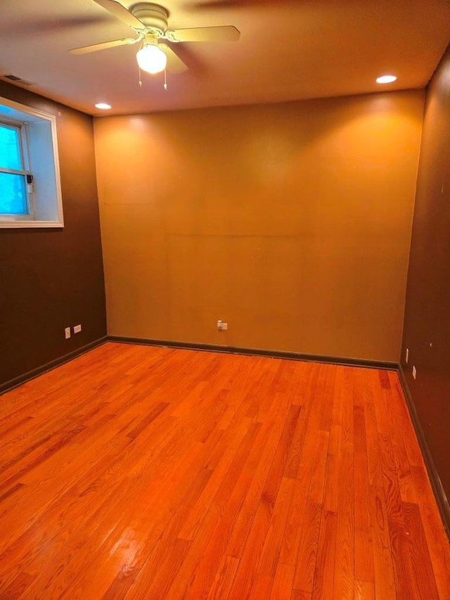 unfurnished room with light hardwood / wood-style floors and ceiling fan