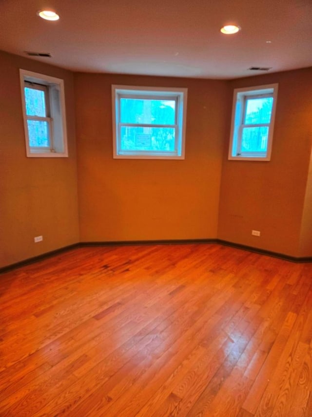 spare room featuring light hardwood / wood-style flooring