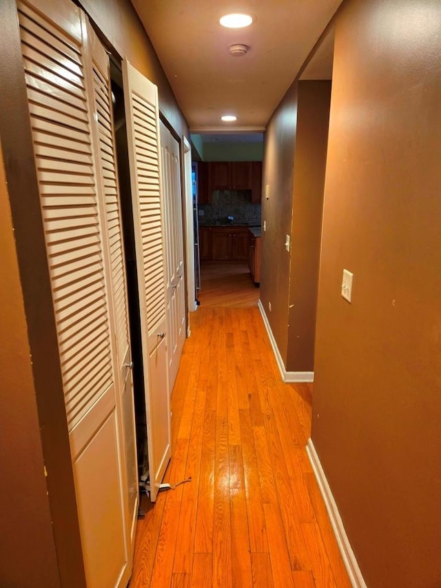 hallway featuring light hardwood / wood-style flooring