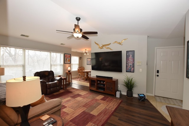 living room with lofted ceiling, dark wood-type flooring, and ceiling fan