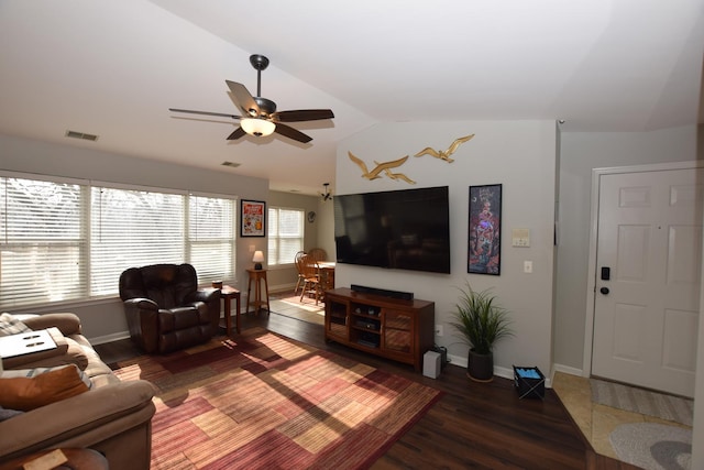 living room with lofted ceiling, dark hardwood / wood-style flooring, and ceiling fan