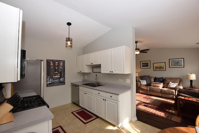 kitchen with dishwasher, sink, pendant lighting, and white cabinets