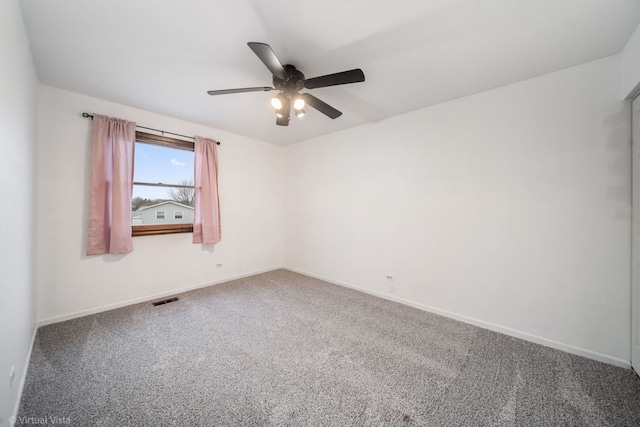 carpeted empty room with ceiling fan