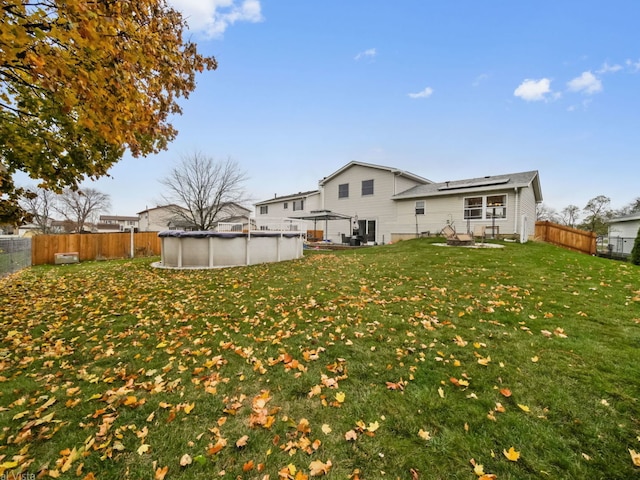 view of yard featuring a covered pool