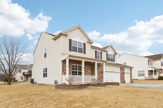 view of front facade featuring cooling unit, a porch, a garage, and a front lawn