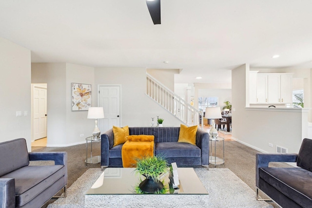 living room featuring light carpet