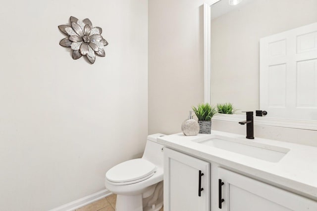 bathroom featuring tile patterned floors, toilet, and vanity