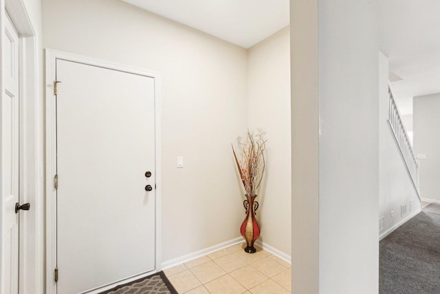 entryway featuring light tile patterned floors