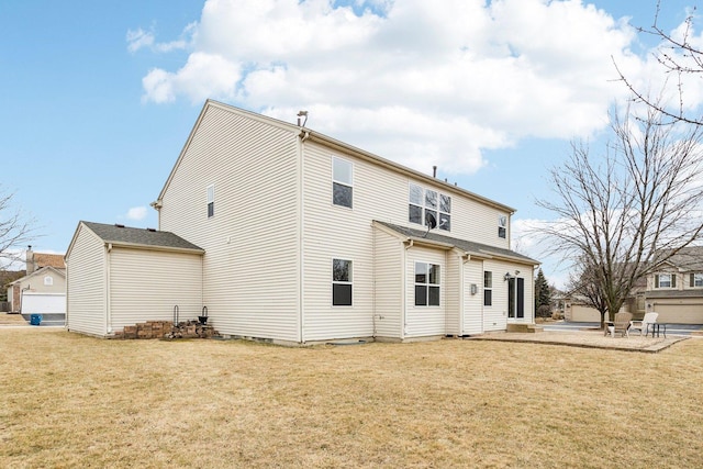 back of house featuring a yard and a patio