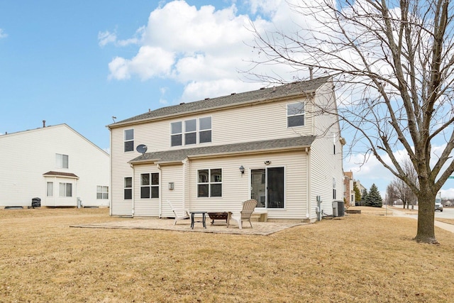 back of house with central AC, a lawn, and a patio