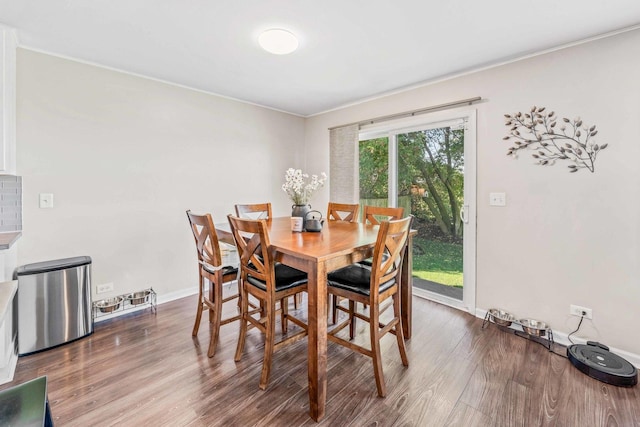 dining room with hardwood / wood-style flooring