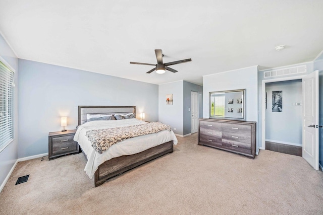 bedroom featuring light colored carpet and ceiling fan