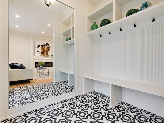 mudroom with built in shelves