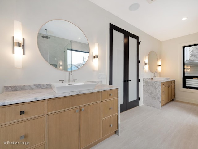 bathroom featuring vanity and a shower