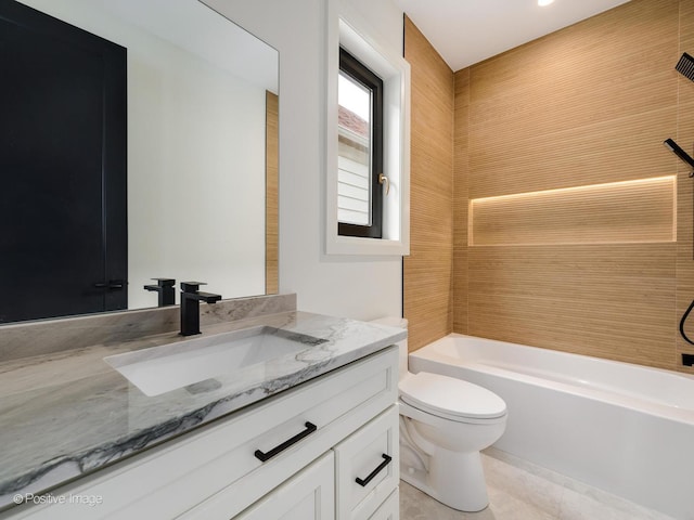 full bathroom featuring shower / bath combination, vanity, and toilet