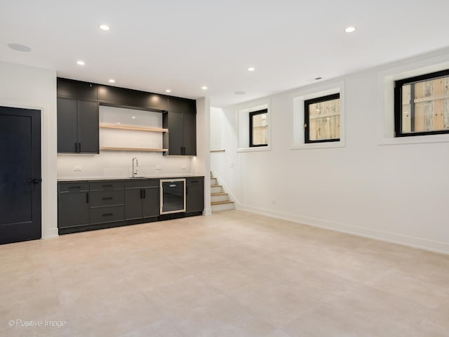 bar featuring sink and beverage cooler