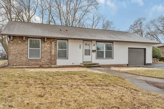 ranch-style home with a garage and a front yard