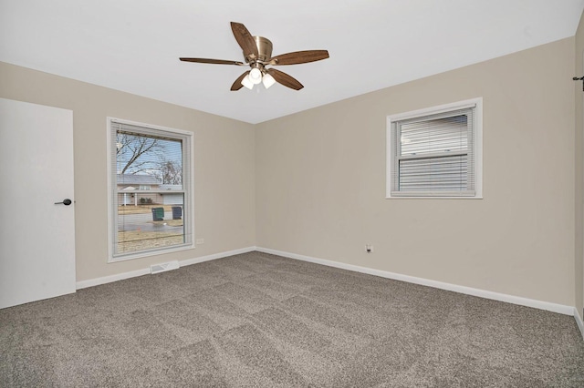 unfurnished room with carpet floors and ceiling fan