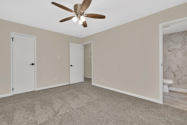 unfurnished bedroom featuring ensuite bathroom, carpet, and ceiling fan