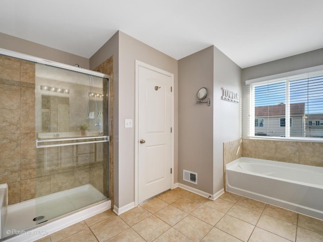 bathroom with tile patterned flooring and plus walk in shower