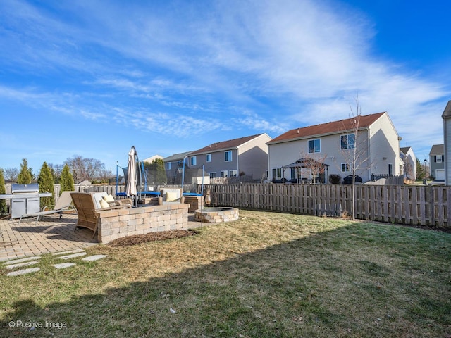 view of yard with a patio and a trampoline