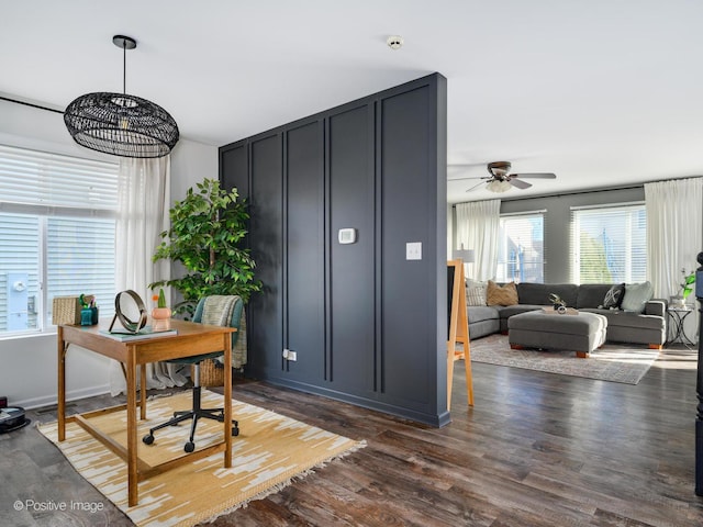 office space with ceiling fan and dark hardwood / wood-style flooring