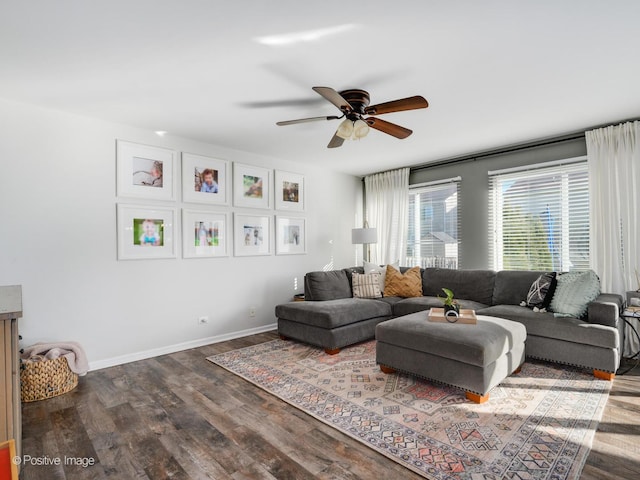 living room featuring ceiling fan and wood-type flooring