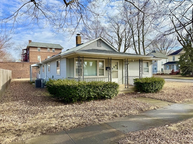 view of front of property with cooling unit and a porch