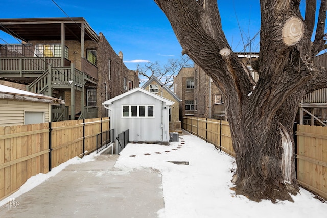 exterior space featuring fence private yard, a residential view, and cooling unit