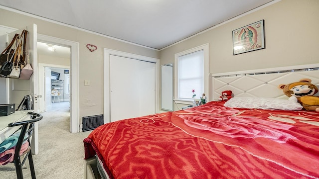 bedroom with crown molding and light colored carpet