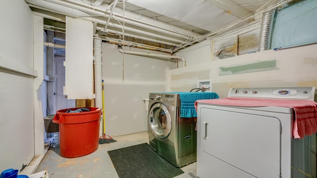 laundry room with washing machine and clothes dryer