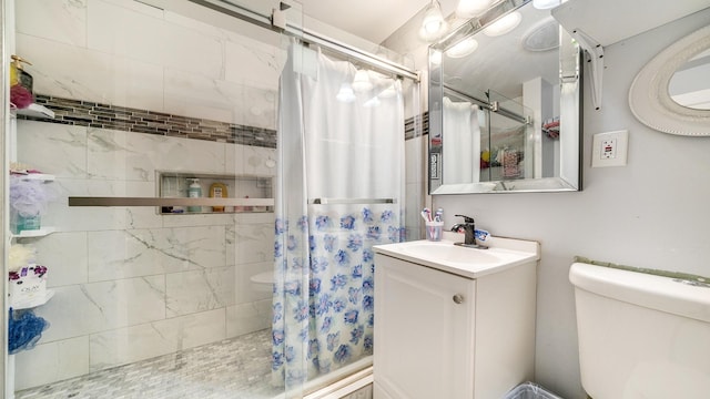 bathroom with vanity, a shower with curtain, and toilet