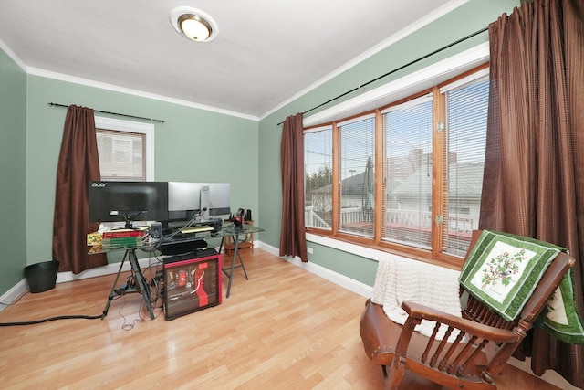 home office featuring crown molding and light wood-type flooring