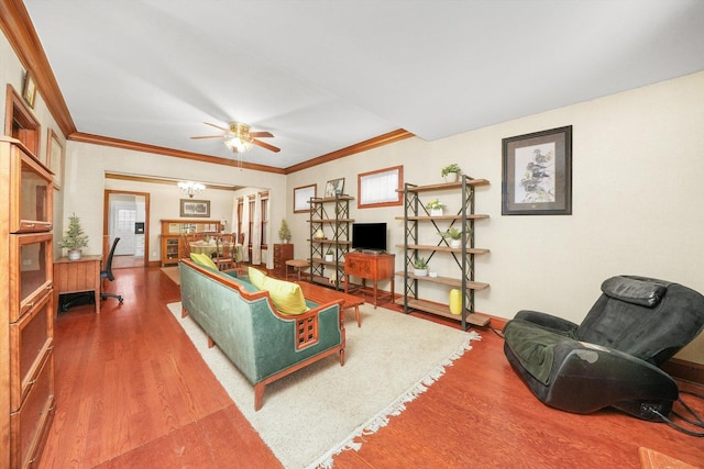 living room featuring crown molding, wood-type flooring, and ceiling fan with notable chandelier