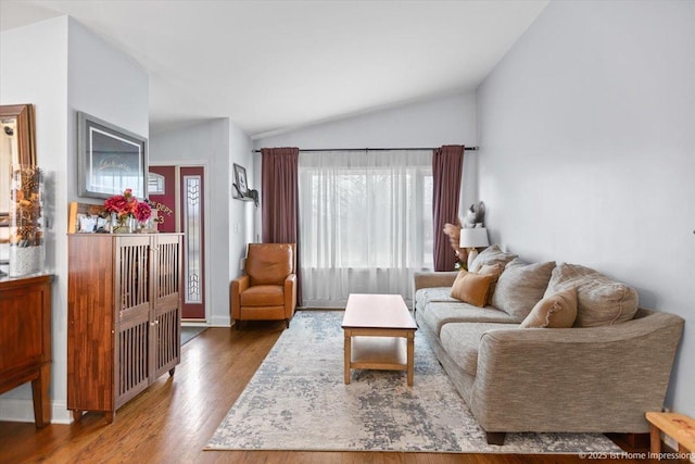 living room with dark wood-type flooring and lofted ceiling