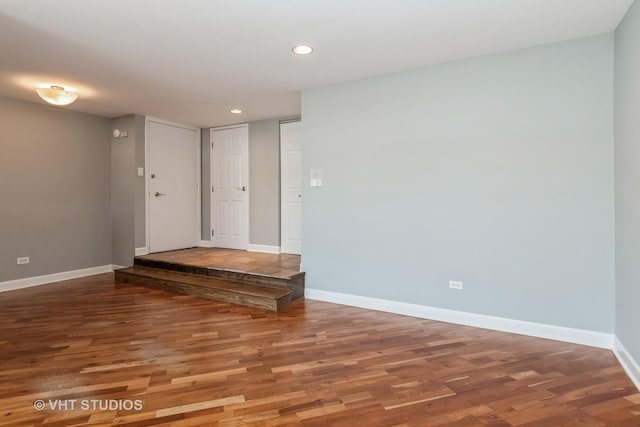 spare room with hardwood / wood-style flooring