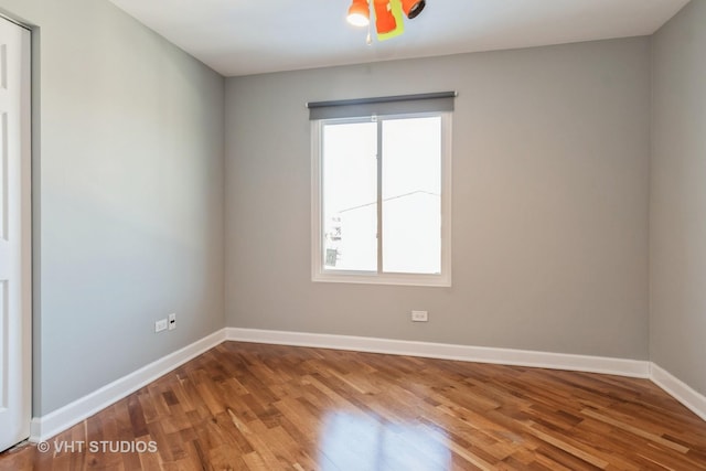 spare room with wood-type flooring