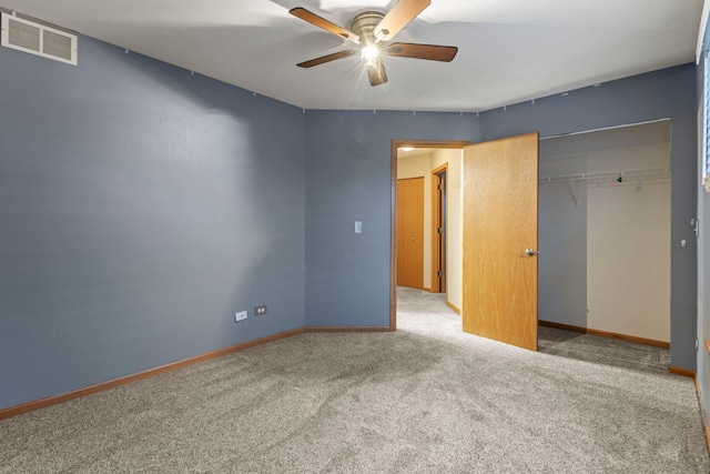 unfurnished bedroom featuring carpet flooring, ceiling fan, and a closet