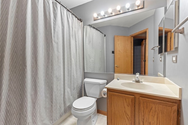 bathroom with vanity, curtained shower, and toilet