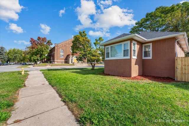 view of home's exterior featuring a lawn