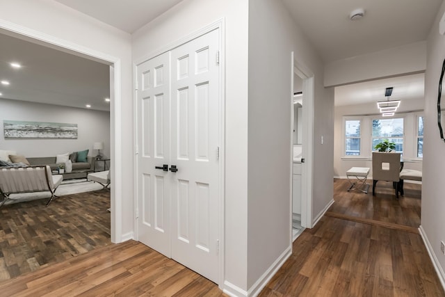 hallway featuring dark hardwood / wood-style floors