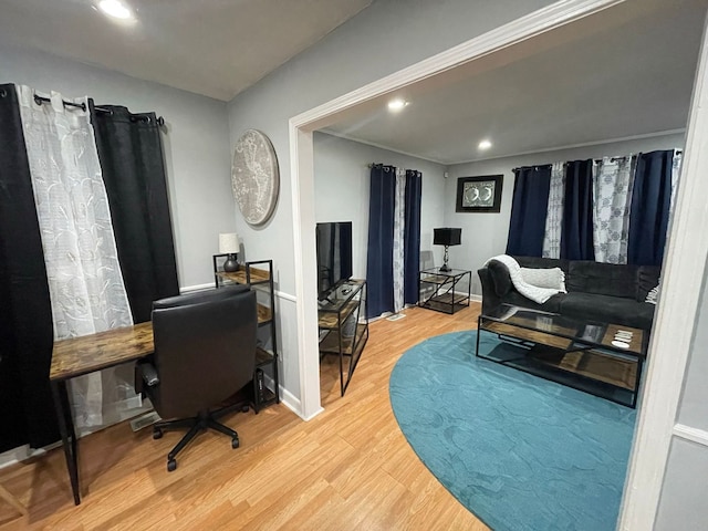 home office with hardwood / wood-style flooring