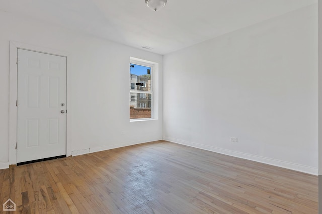 unfurnished room featuring light hardwood / wood-style floors