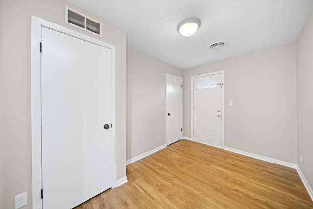 foyer with hardwood / wood-style flooring