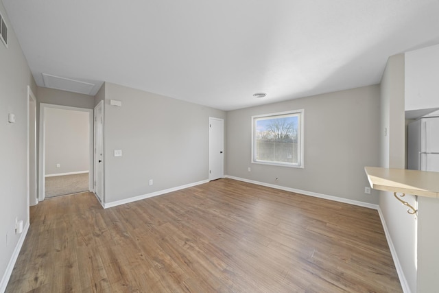 unfurnished living room featuring light hardwood / wood-style flooring