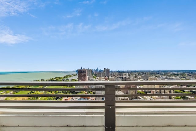 balcony featuring a water view